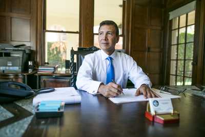 Vicente Sarmiento sitting at his desk